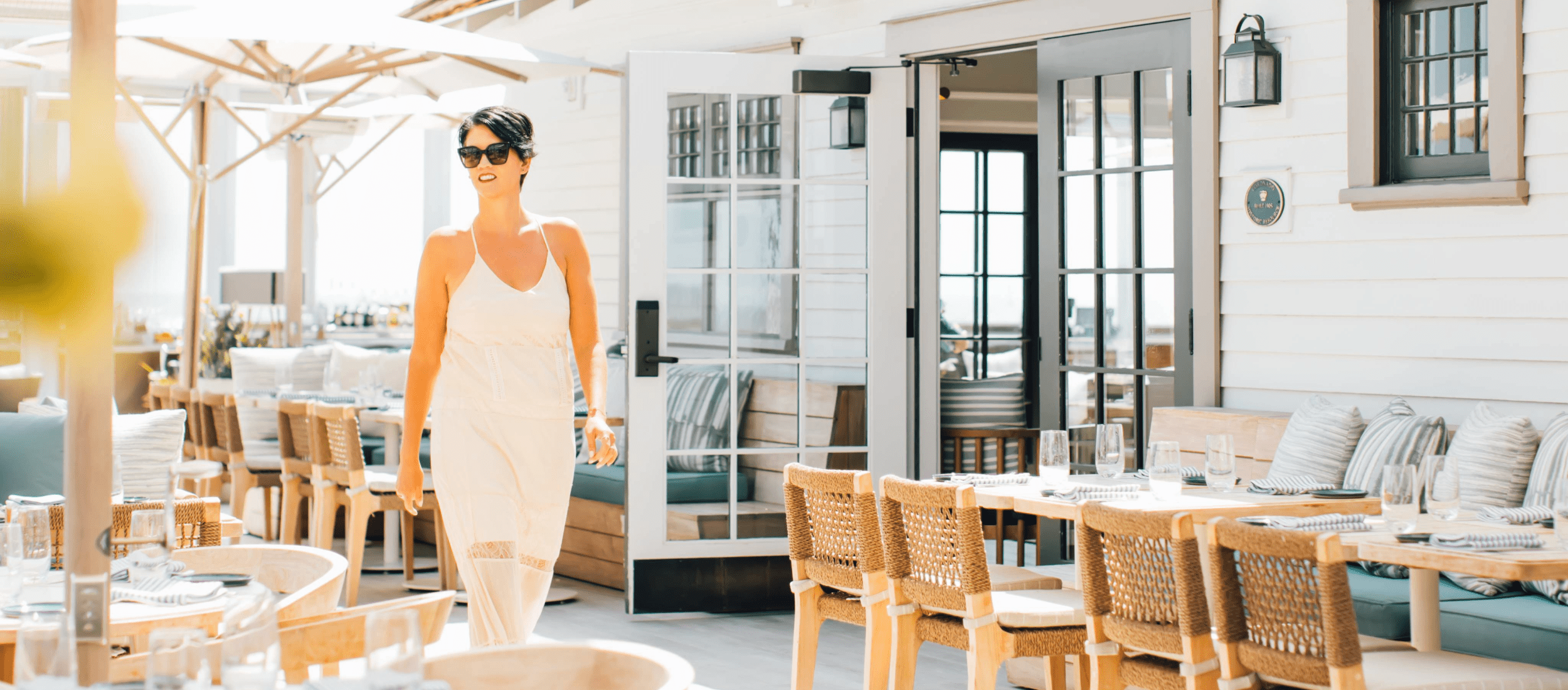 Woman walking on restaurant patio